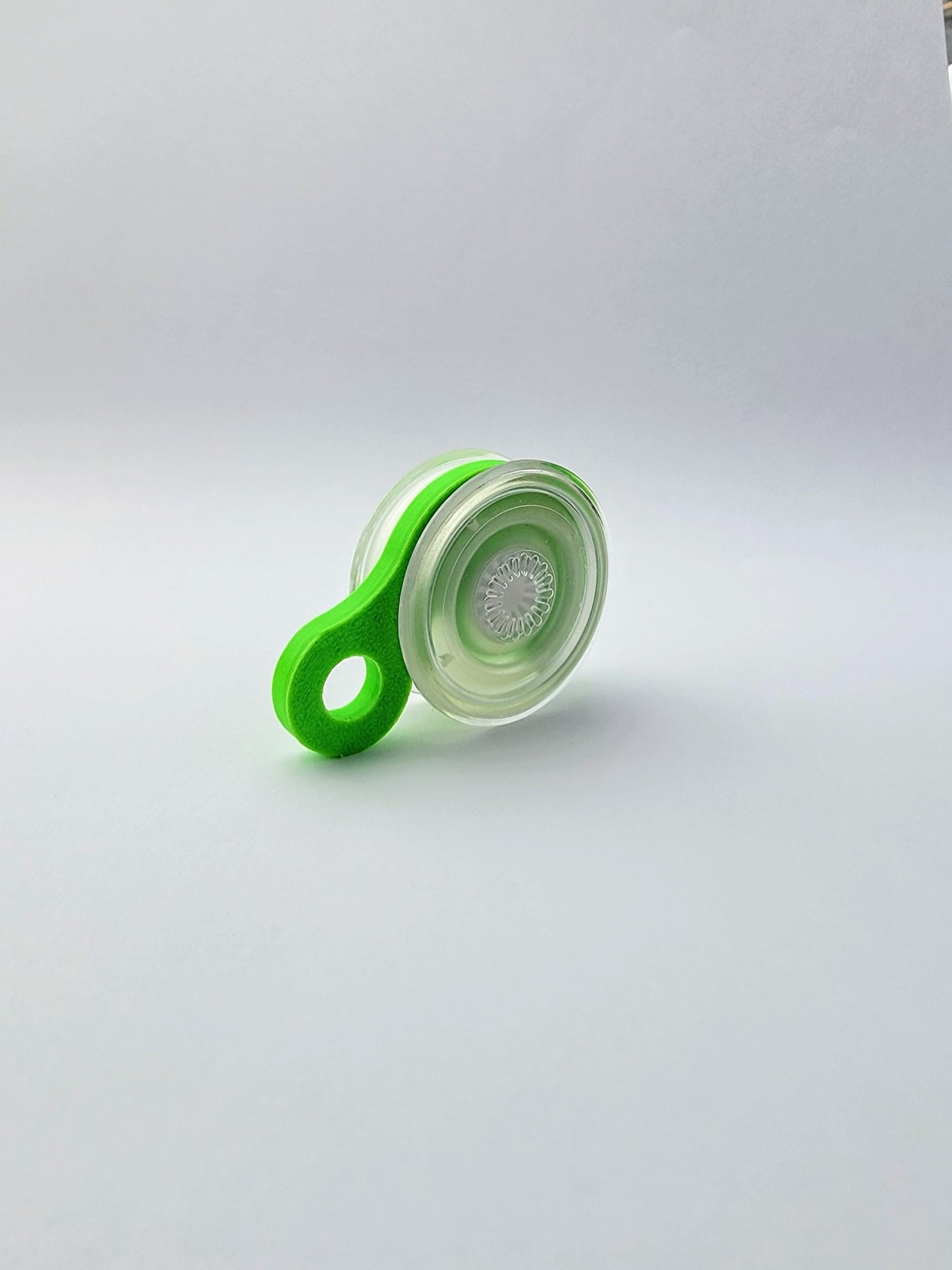 Green and clear PopSocket Popgrip coupler accessory for attaching phone grips securely