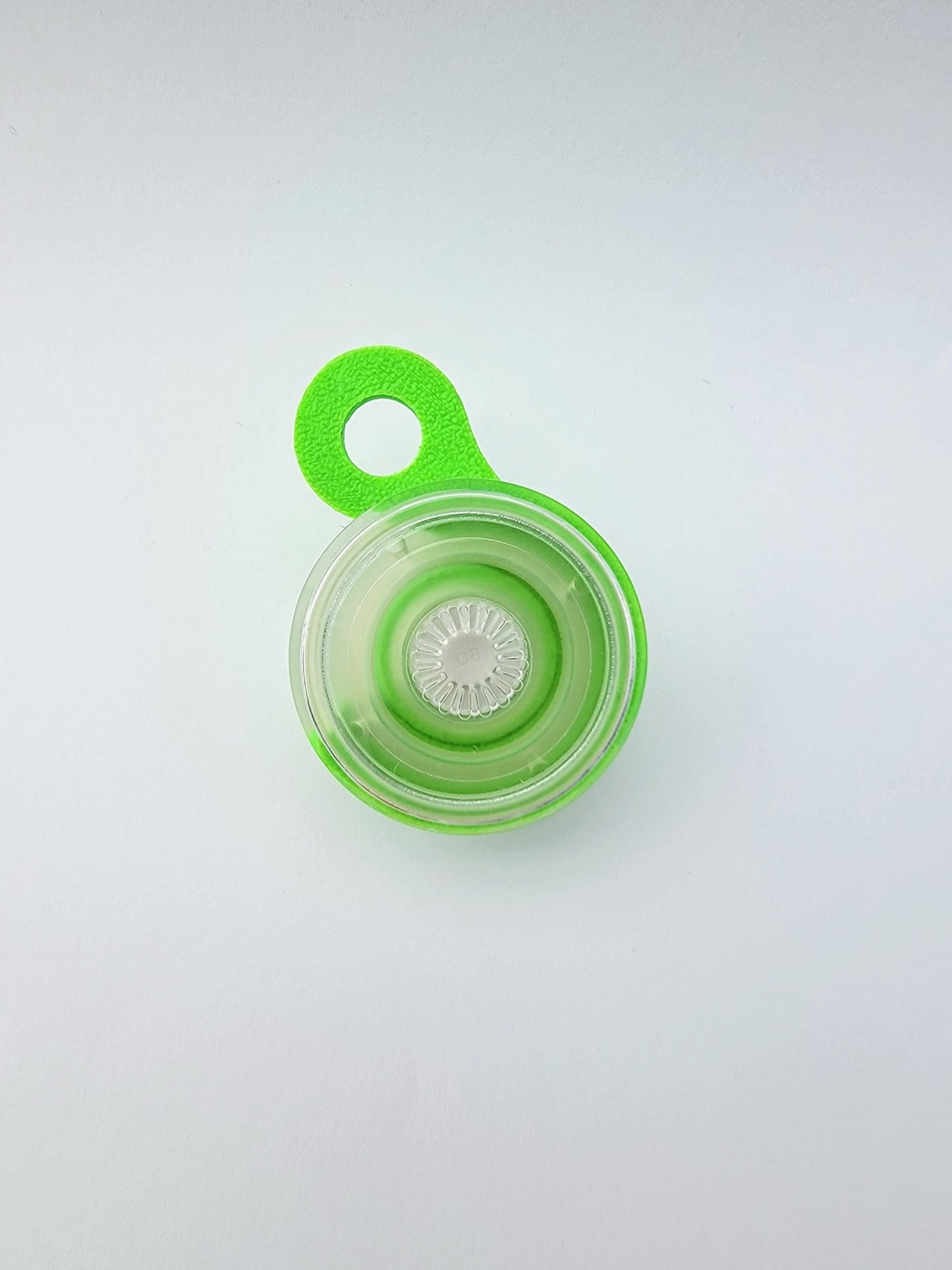 Green and clear PopSocket Popgrip coupler accessory for secure grip and phone stand functionality
