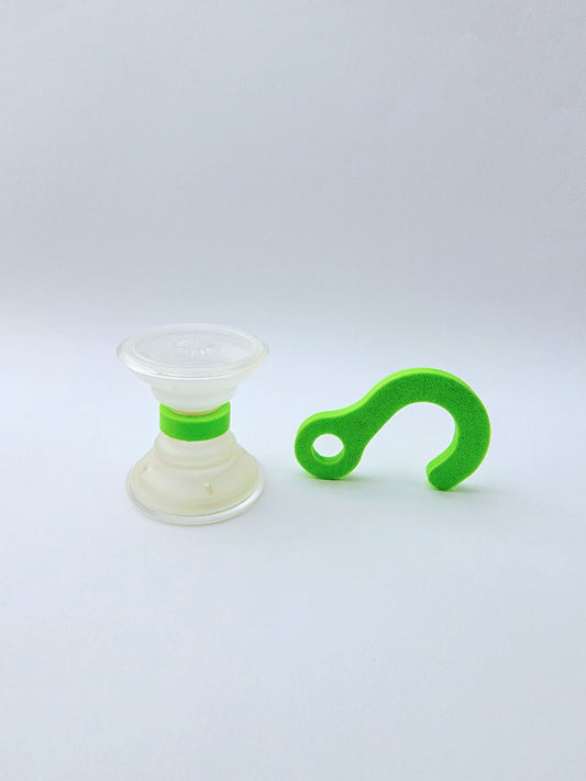 Clear suction cup with bright green PopSocket Popgrip coupler for secure phone attachment