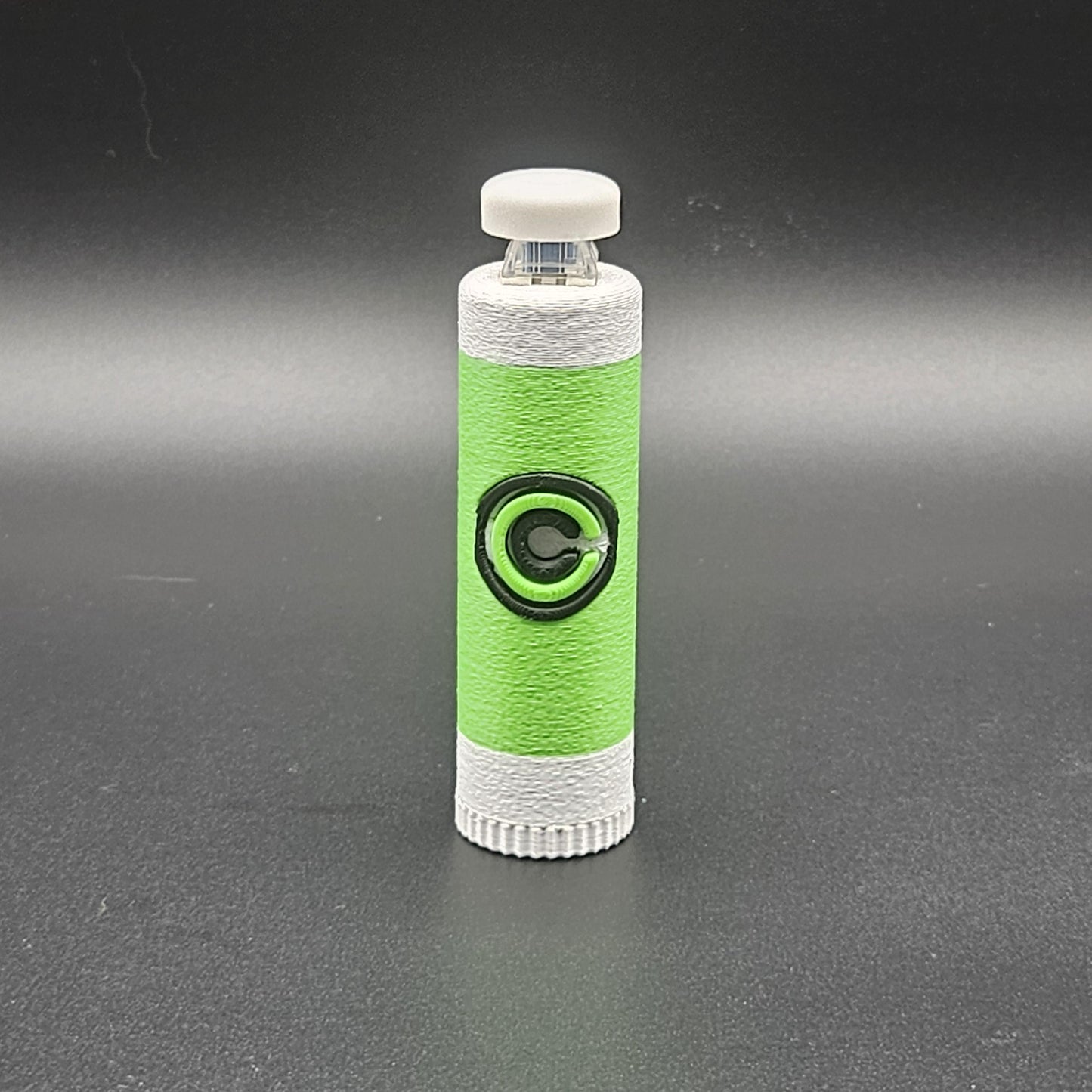 Green and white clicky fidget with storage compartment DBZ featuring Capsule Corporation logo