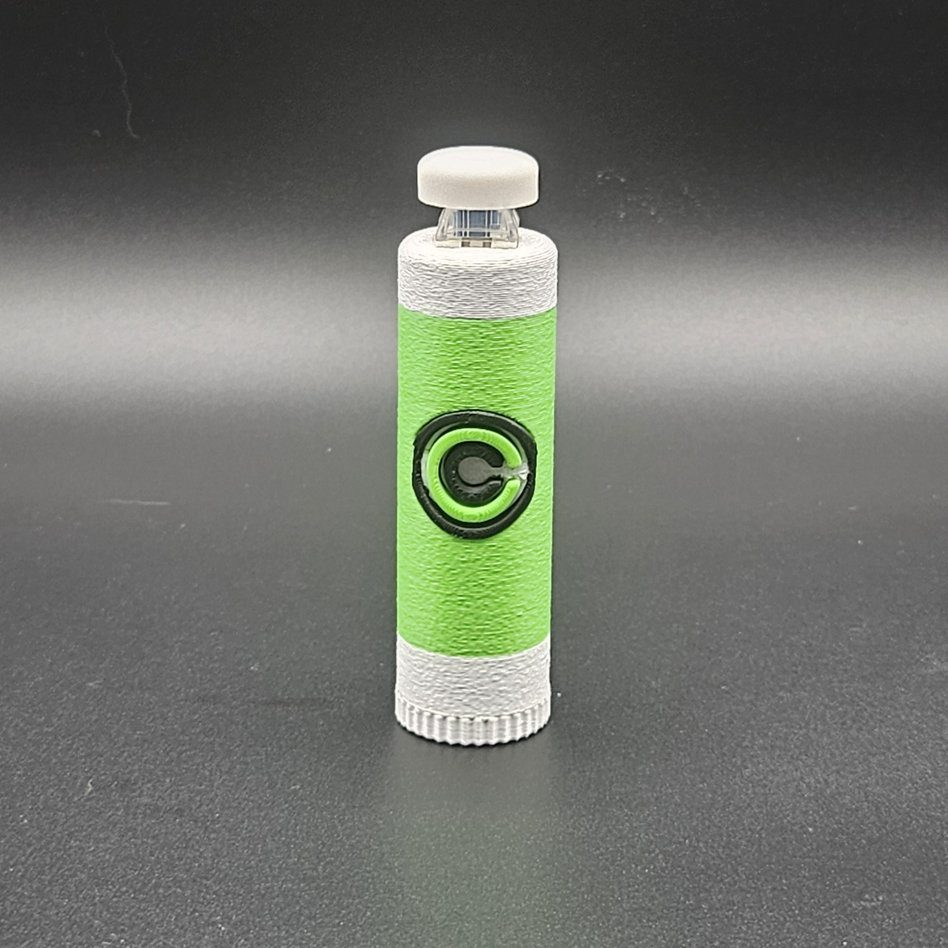 Green and white clicky fidget with storage compartment DBZ featuring Capsule Corporation logo