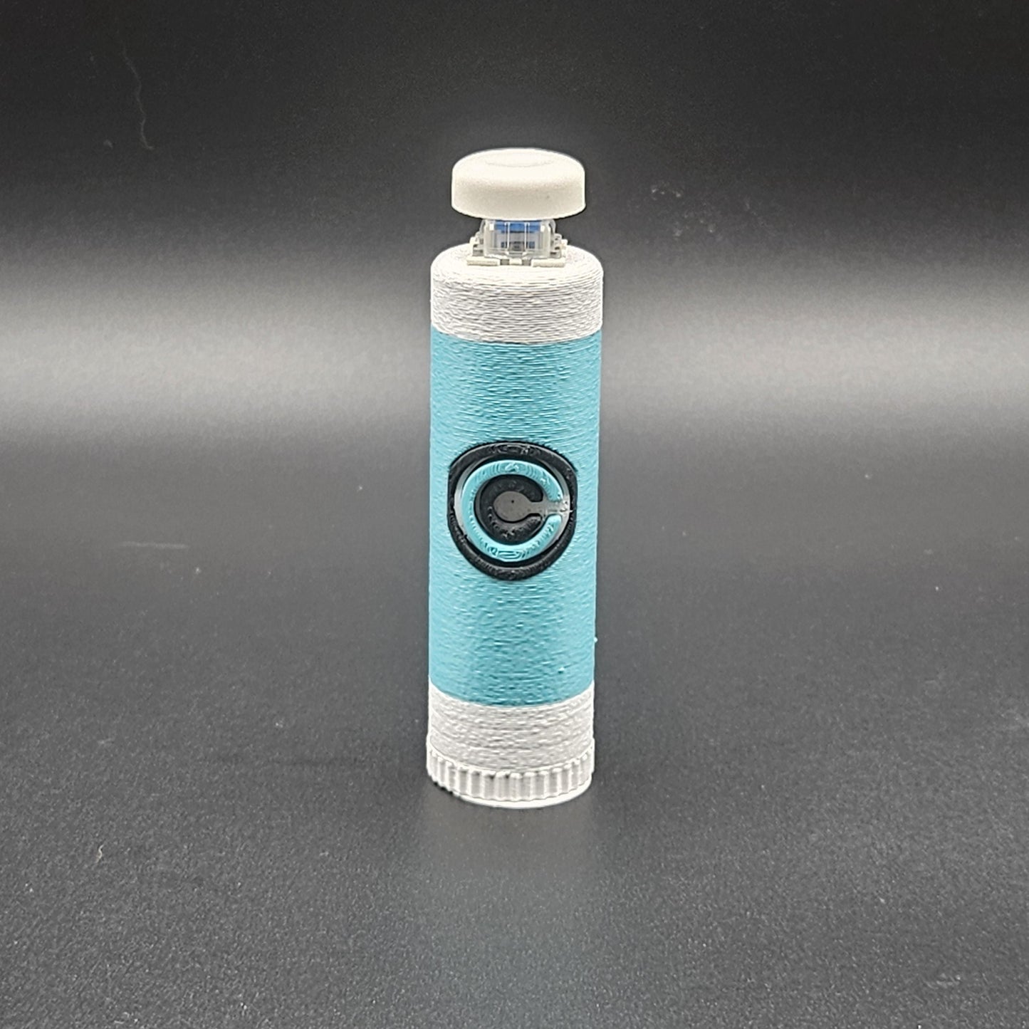 Blue and white clicky fidget with storage compartment DBZ featuring Capsule Corp logo