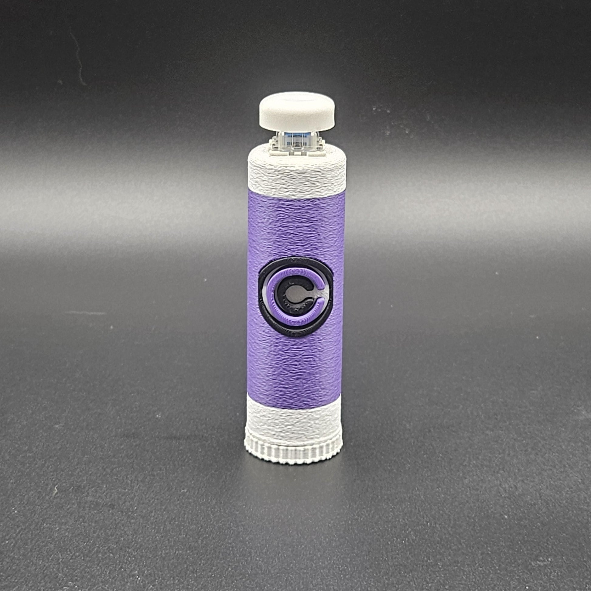Purple and white clicky fidget with storage compartment DBZ featuring a Capsule Corp logo design
