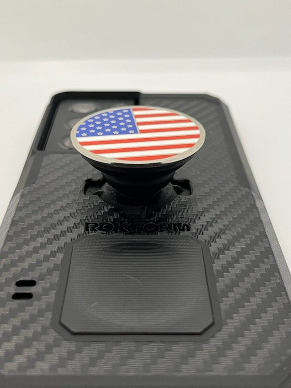 Rokform PopSocket adapter attached to a black carbon fiber phone case with American flag design